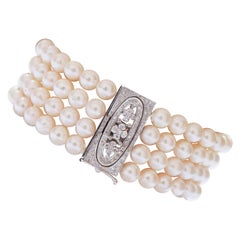Perles, diamants, bracelet Retrò en platine.