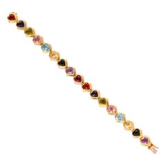 An 18 Carat Gold and Gemstone Heart Bracelet