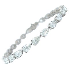 Bracelet tennis est-ouest en platine avec diamants taille poire (12,61 carats VS) par Arnav