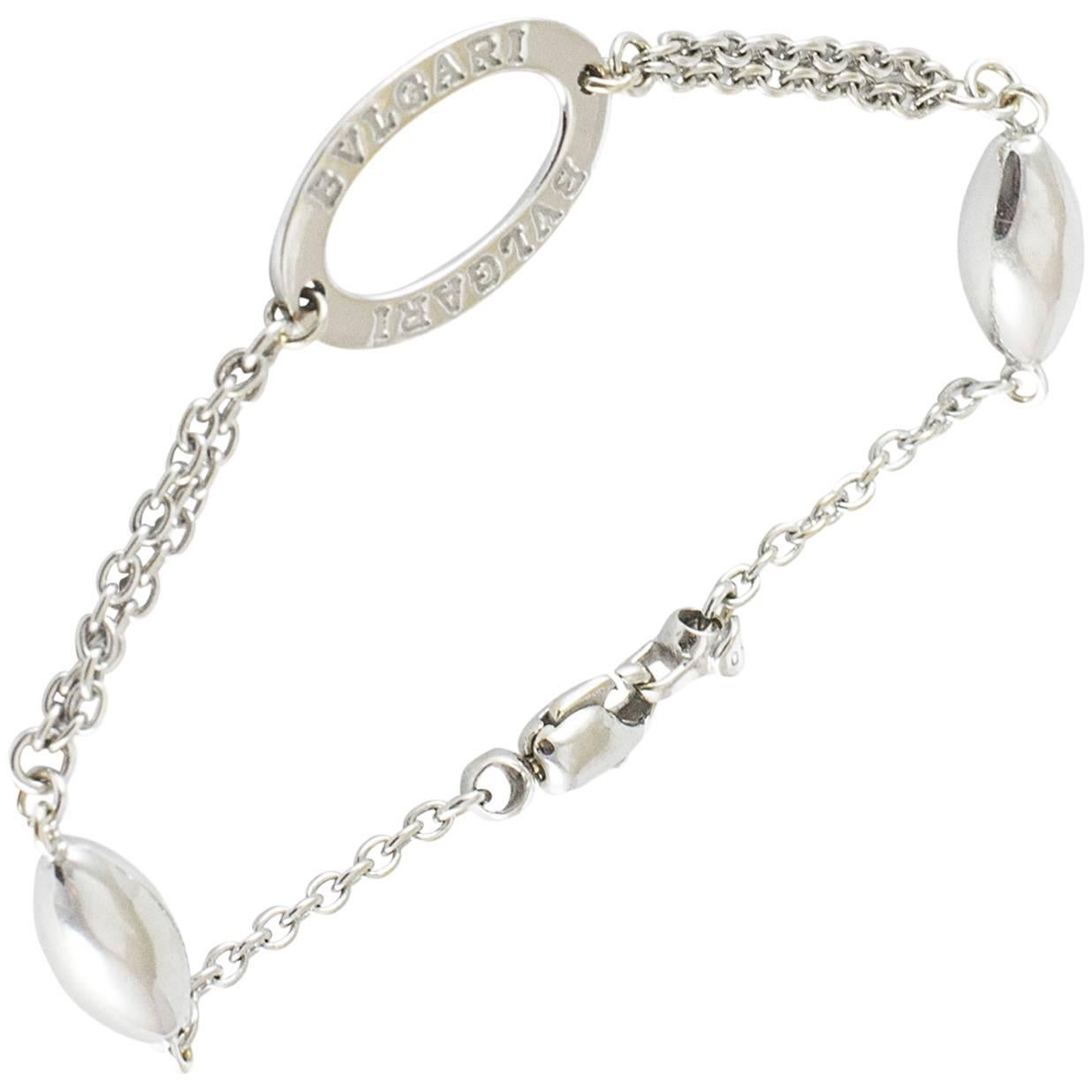 A classic Bvlgari Signature chain bracelet in 18k white gold. The central open gold oval bares the Bvlgari trademark. This piece weighs 8.4 grams and measures 7.5 inches. It is in excellent condition.