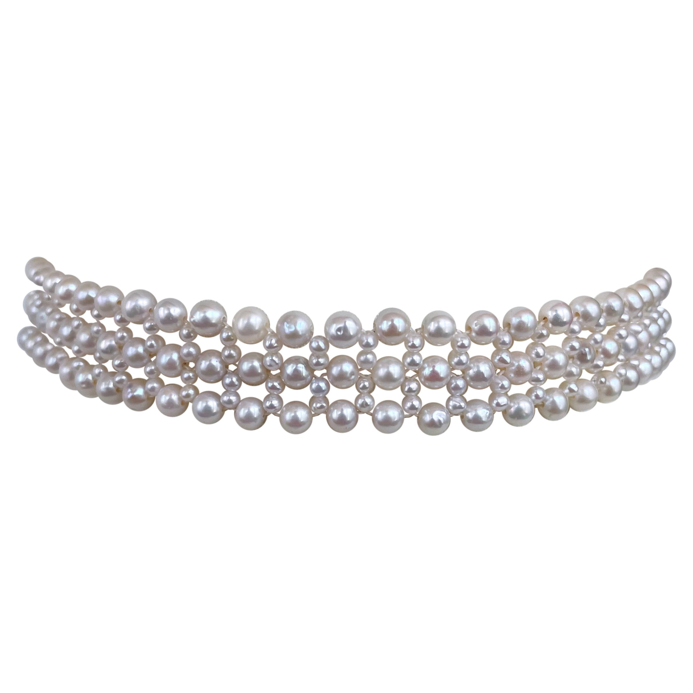 Classic and elegant Pearl woven choker for the modern woman - by Marina J. This piece features 2.5mm, 4.5mm and 5mm cultured White Pearls all intricately woven into a beautiful lace like design. Measuring half an inch thick and 13 inches long, this
