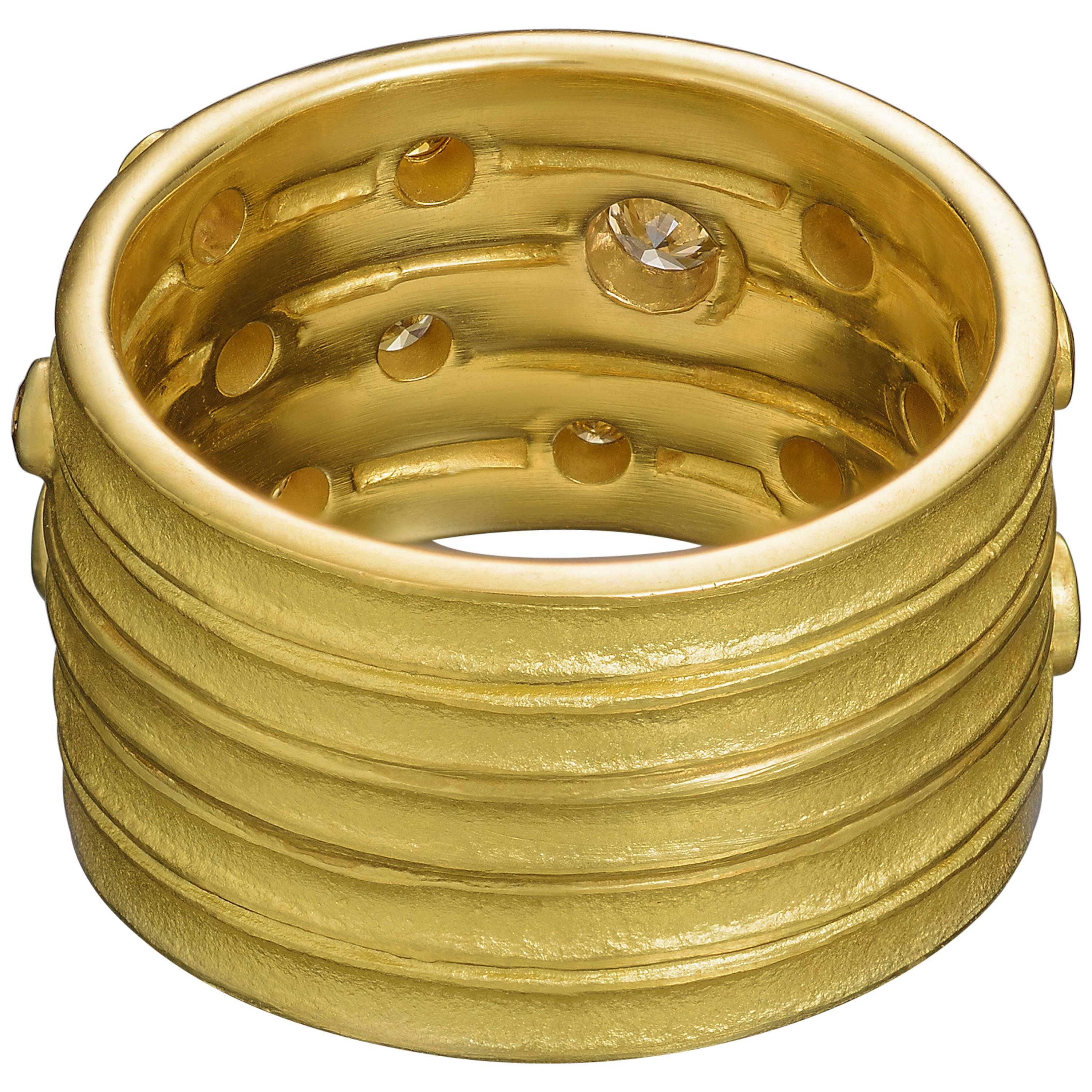 18kt Gold handmade ribbed band with 14 Yellow, Champagne, Cognac and White Diamonds.

* Each piece is designed and crafted entirely by hand in the traditional way, using age old techniques and processes.

*Ring is sized as 5.5 but can be resized