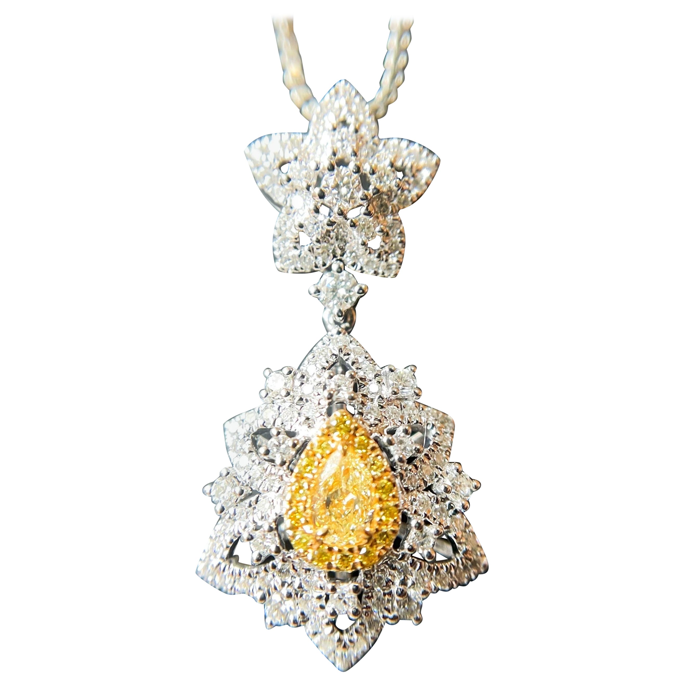 Natural Drop Shape Yellow Diamond Pendant set in 18K White Gold with Diamond  For Sale