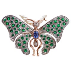 Broche papillon en saphir, diamants, spinelle, or rose et argent