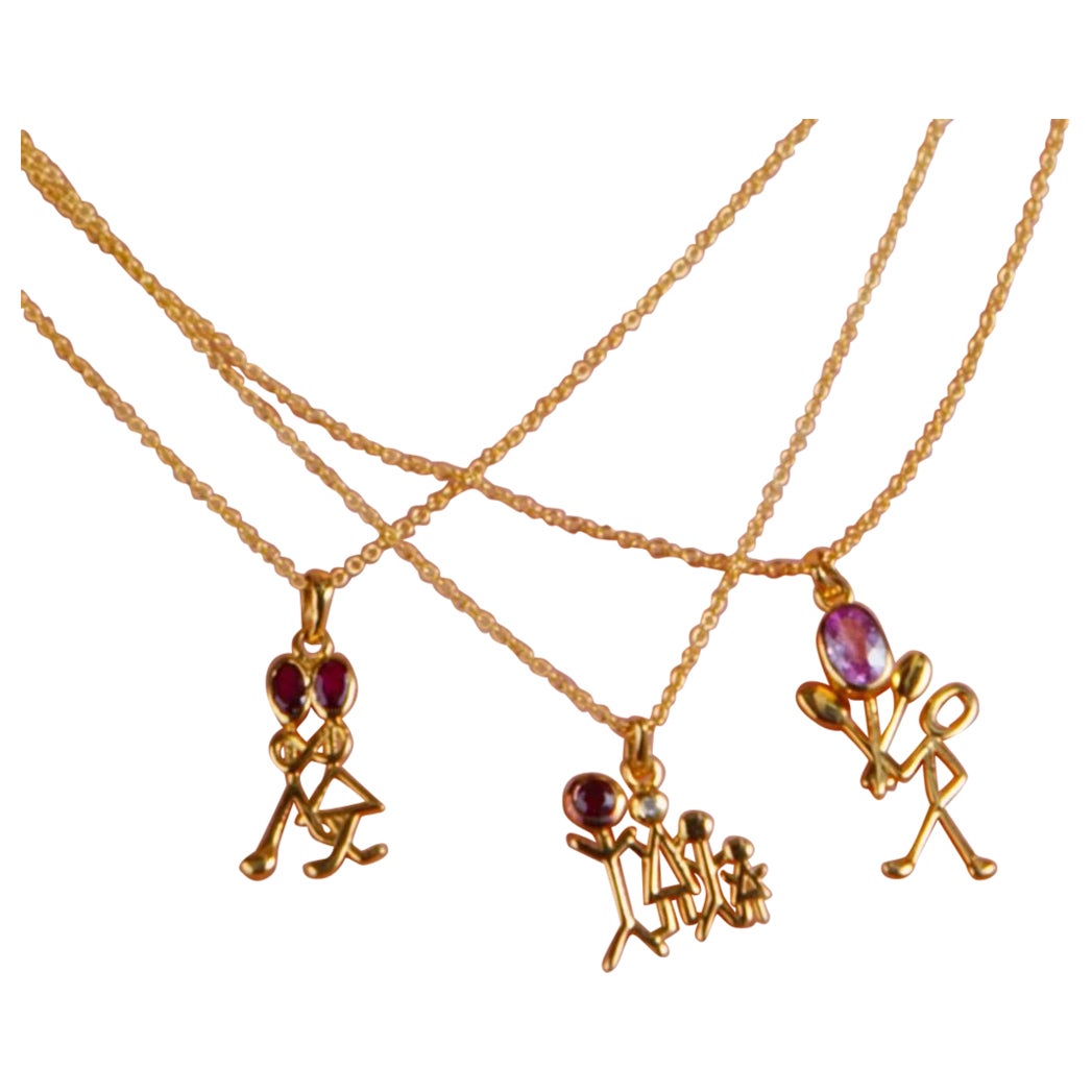 0.24 Carat Total Weight Ruby Yellow Gold Stick Figure Pendant Necklace For Sale