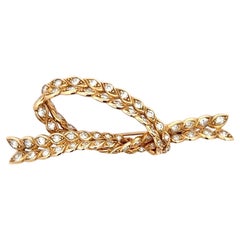 An 18k yellow gold and Diamond brooch by Sterlé