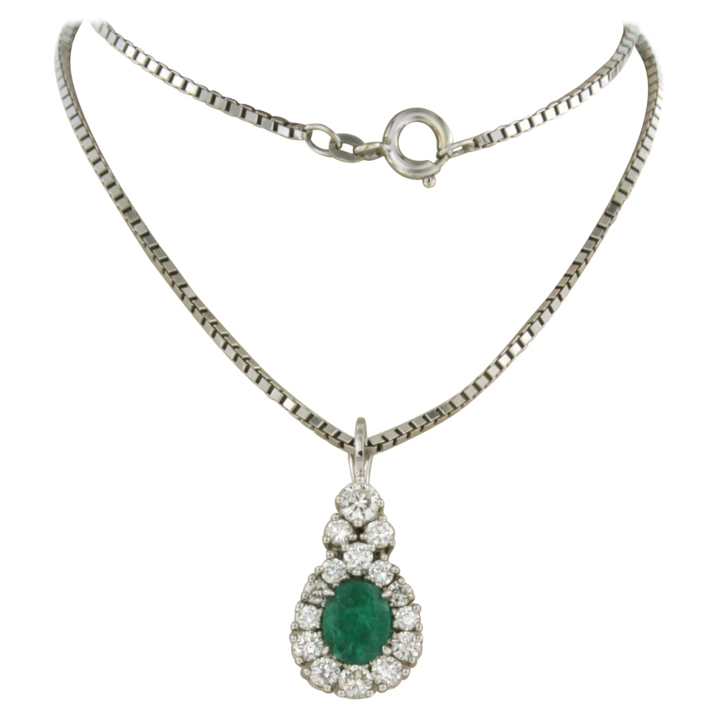 Chain and pendant set with emerald and briljant cut diamonds 14k white