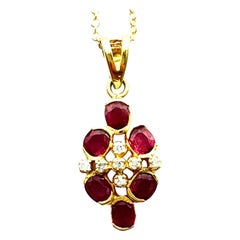 14 Karat yellow gold .75CTW Oval Ruby Diamond Cluster Drop Pendant