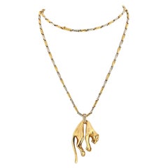 Cartier, collier pendentif panthère suspendu iconique en or jaune 18 carats