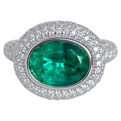 Lotus East West Ring with 3ct Emerald Solitaire, Blue Sapphire and Diamonds