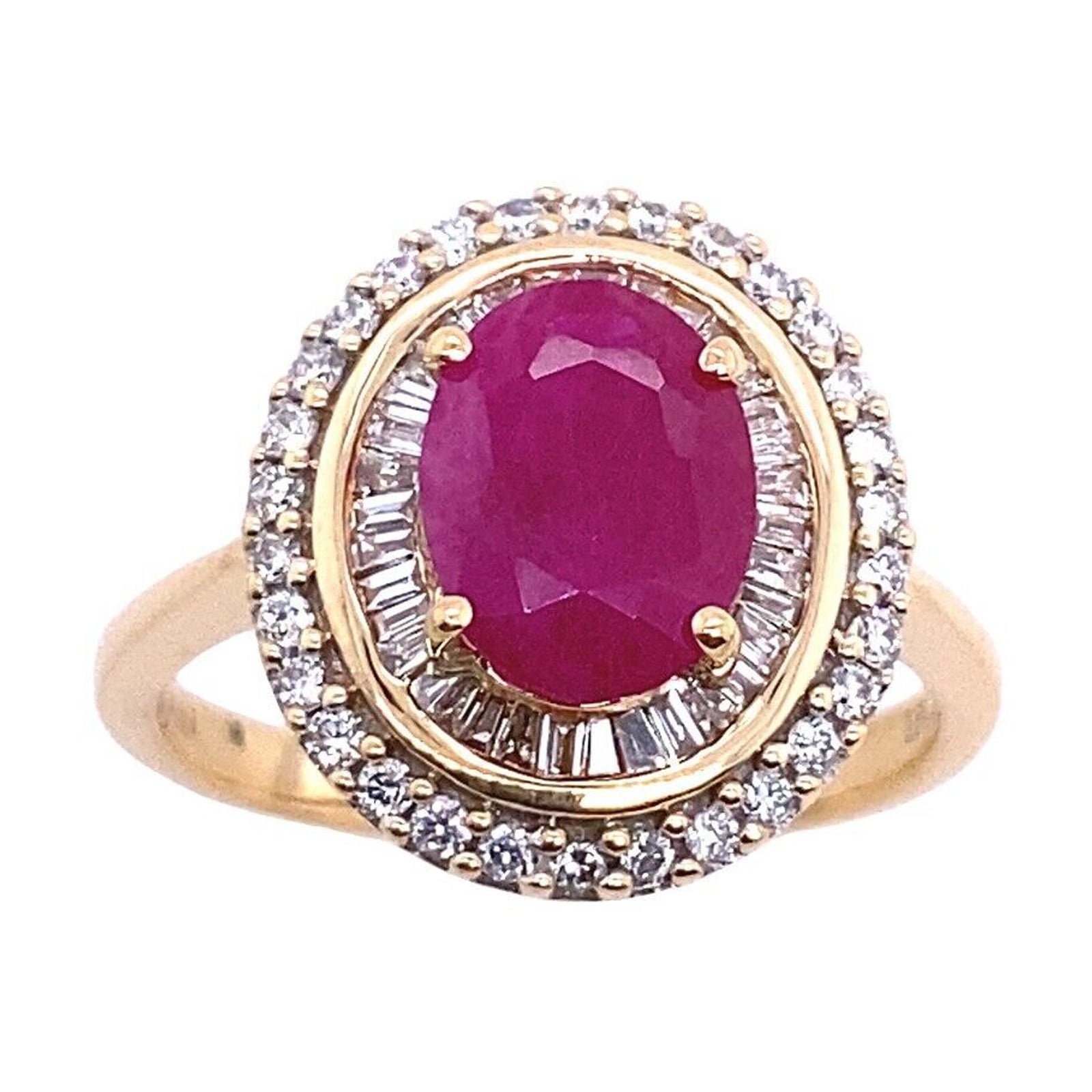 18ct Oval 1.50ct Ruby Ring Surrounded by 1 Row of Baguettes + Round Diamonds For Sale
