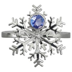 Tanzanite gold ring. Snowflake 14 karat Gold Ring with Tanzanite and Diamonds.