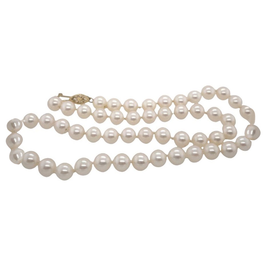 Collier de perles d'eau douce avec fermoir en or 14ct en vente