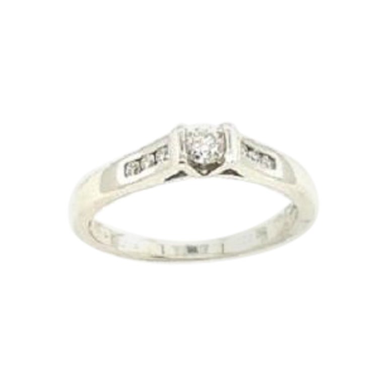 Classic Solitaire Diamond Ring with Channel Set Shoulders For Sale