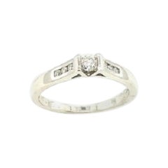 Classic Solitaire Diamond Ring with Channel Set Shoulders