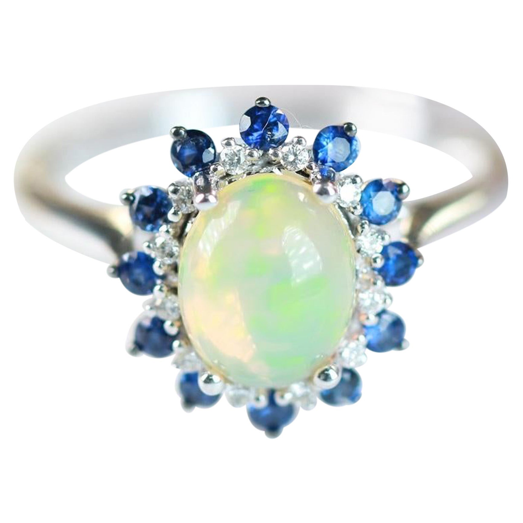 1.44 Carat Oval Cab Ethiopian Opal Blue Sapphire and Diamond 10K White Gold Ring For Sale