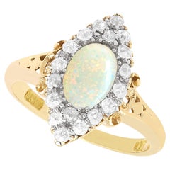 Anello vittoriano con opale da 0,50 carati e diamante da 0,33 carati in oro giallo 18k