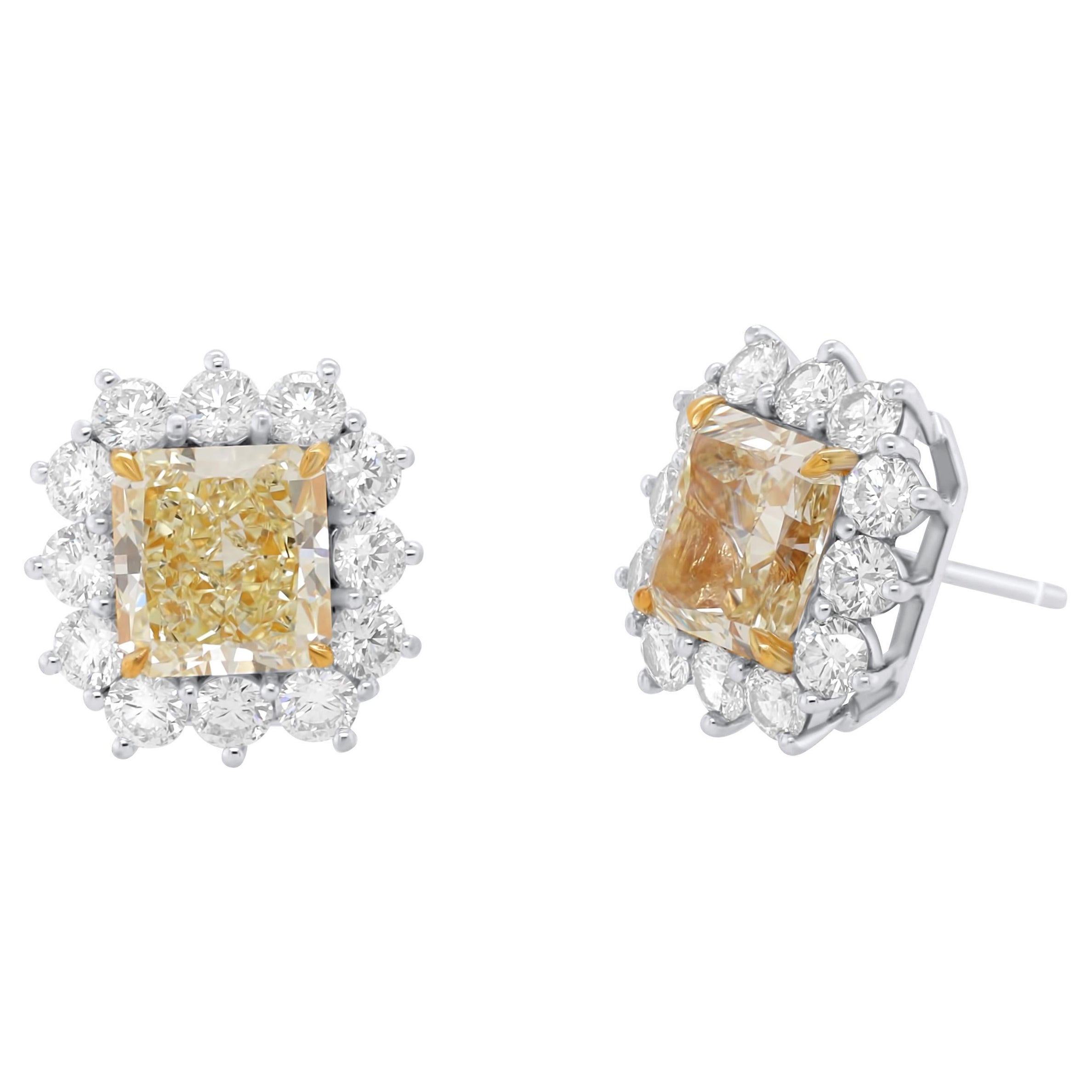 Diana M. yellow diamond Stud Earrings 6.79ct yellow Diamonds 3ct of halo