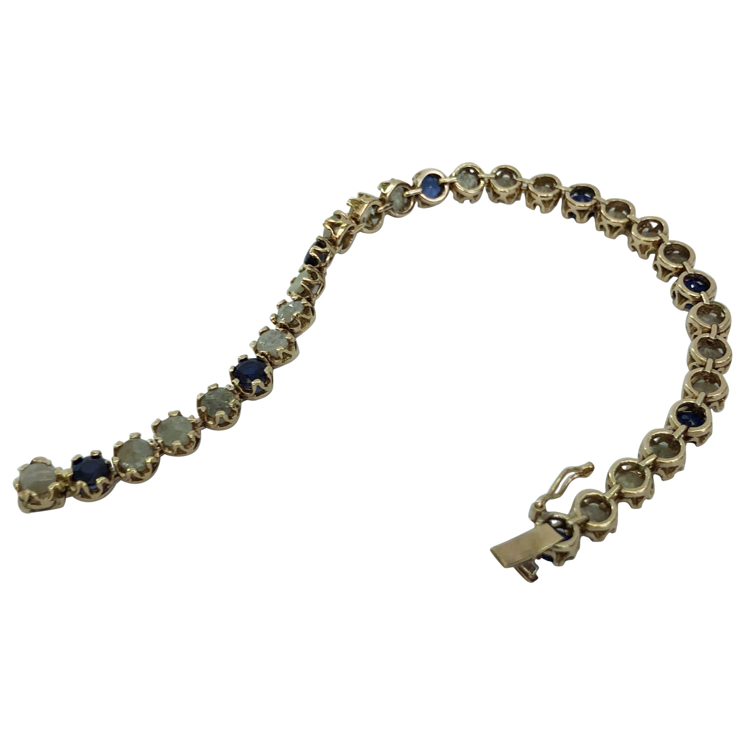 Bracciale con zaffiri e diamanti in oro giallo 14 carati