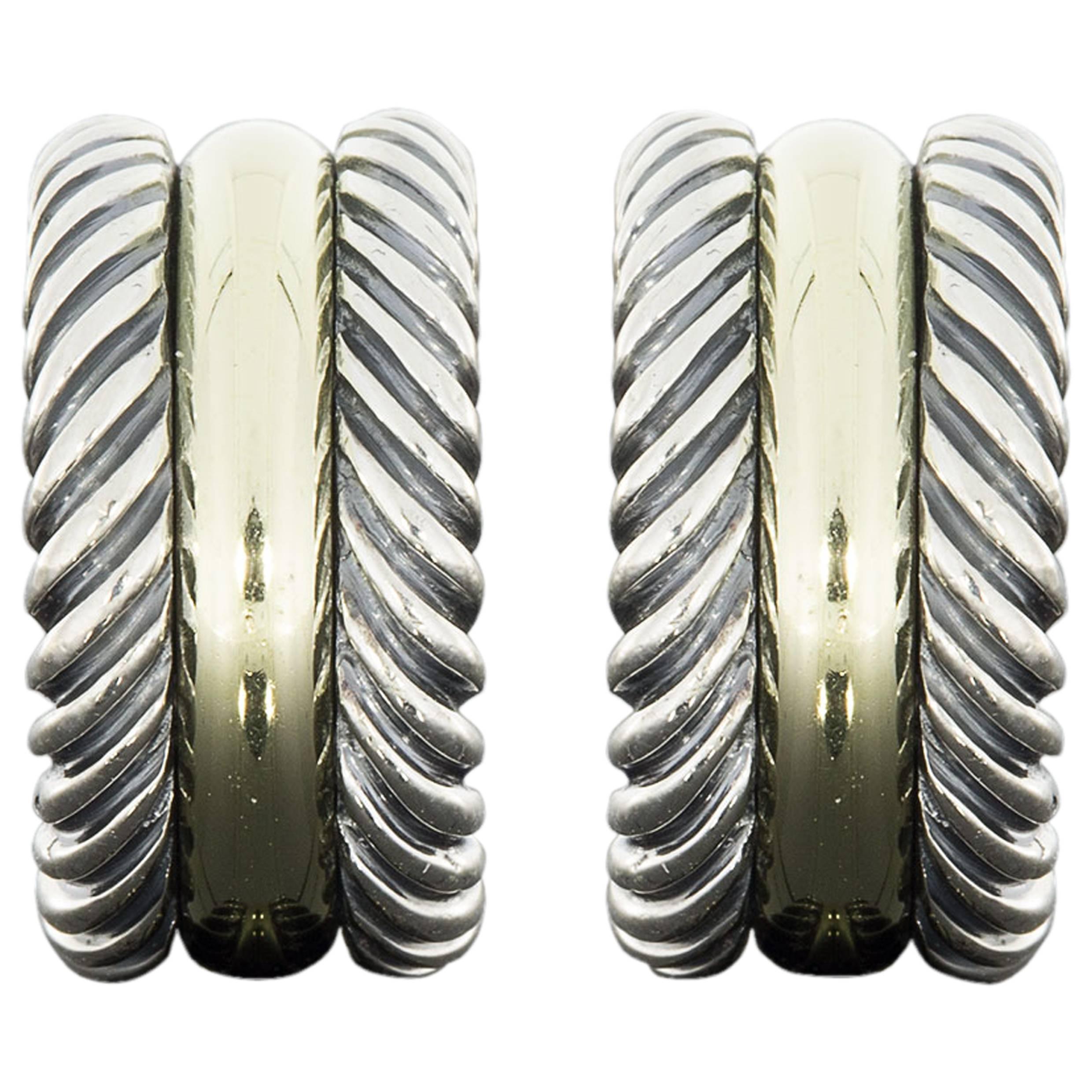 David Yurman's cable style jewelry has become his signature, the unifying element of every collection. These beautiful Cable Classics Collection earrings have 2 rows of sterling silver cable framing a center row of 14 karat yellow gold. They are