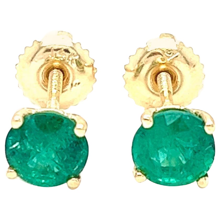 1.31 carats round Emerald Stud Earrings in 14K Yellow Gold. For Sale