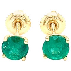 1.31 carats round Emerald Stud Earrings in 14K Yellow Gold.
