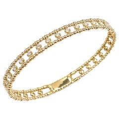 Bracelet jonc semi flexible en or jaune 14 carats avec diamants