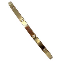 Cartier gold and diamonds collection Love bracelet