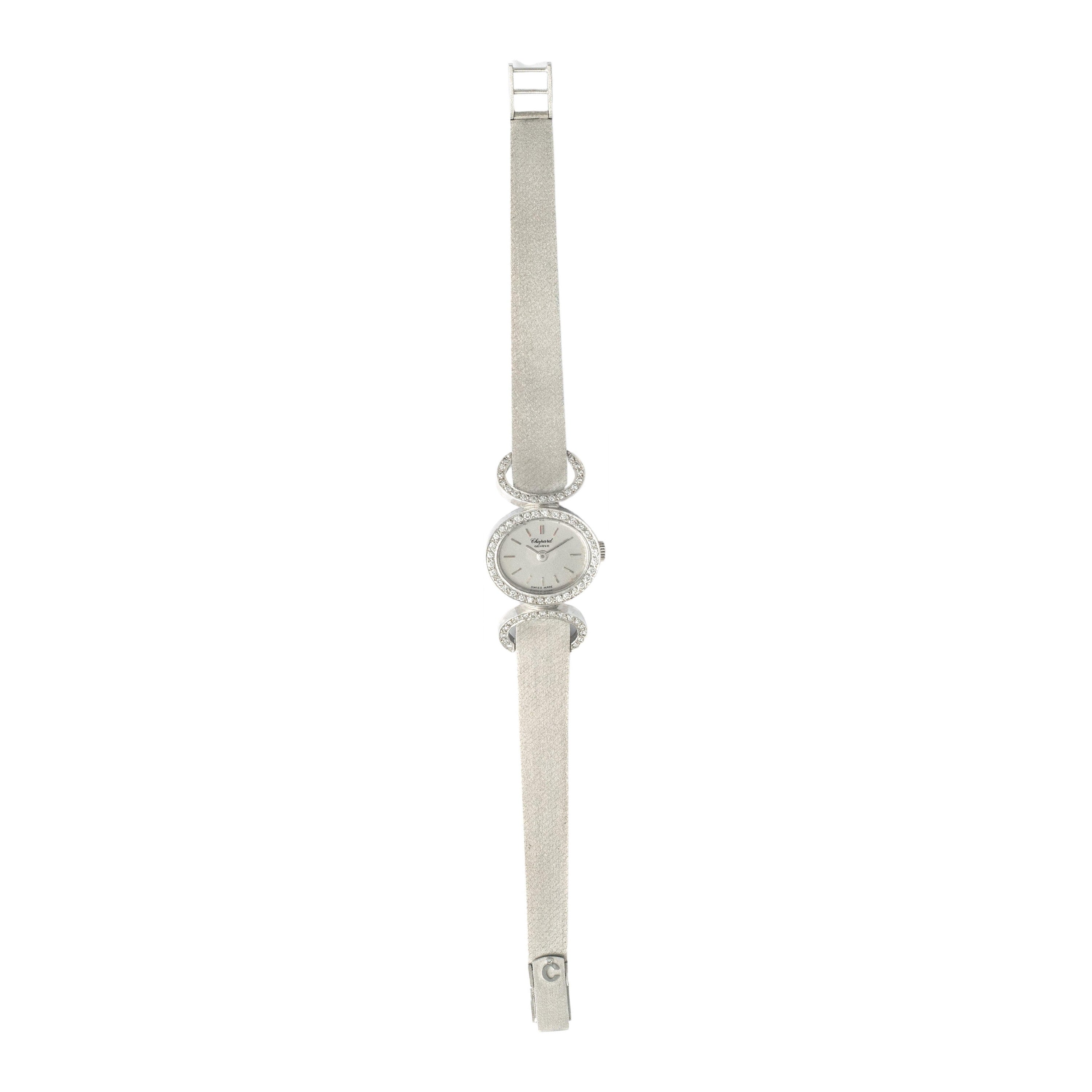 Step into the vintage elegance of the Chopard Wristwatch-a timeless masterpiece crafted in 18K white gold and adorned with a round-cut diamond weighing 0.41 carats. 
This numbered timepiece bears the prestigious Chopard signature, a mark of