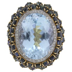 Goldring mit ct 45, 50 blauem Topas, Diamant und ct 12, 88 Saphir