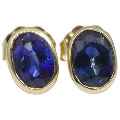 1.38ct Oval Blue Sapphire Stud Earrings set in 14k Yellow Gold