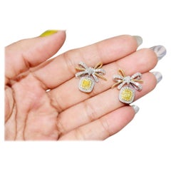 0.752 Carat Fancy Yellow Diamond Earrings SI Clarity AGL Certified