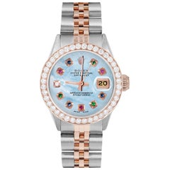 Rolex Montre Datejust bleue avec cadran arc-en-ciel MOP et lunette en diamants pour femmes