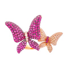 Zwei Schmetterlings-Manschettenringe - Rubin und Diamant, 18 Karat Roségold