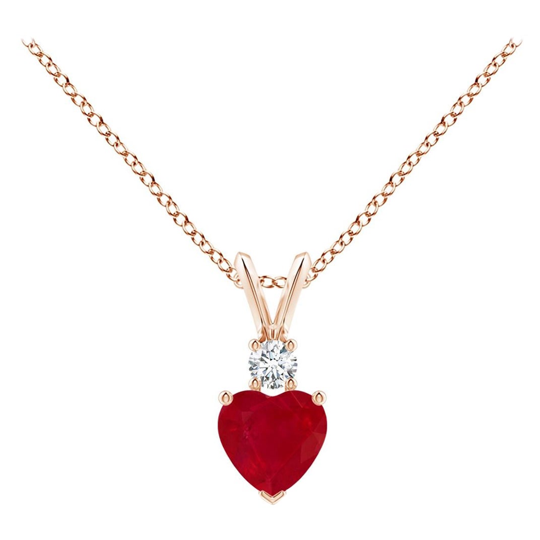 ANGARA Natural Heart-Shaped 0.55ct Ruby Rabbit Ear Bale Pendant in Rose Gold For Sale