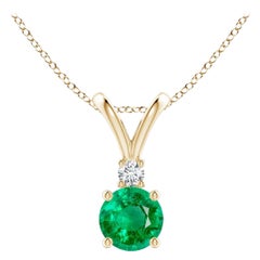 Ciondolo solitario con smeraldo rotondo naturale da 0,45ct e diamante in oro giallo 14K