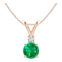 Ciondolo solitario con smeraldo rotondo Nature da 0,75ct e diamante in oro rosa 14K