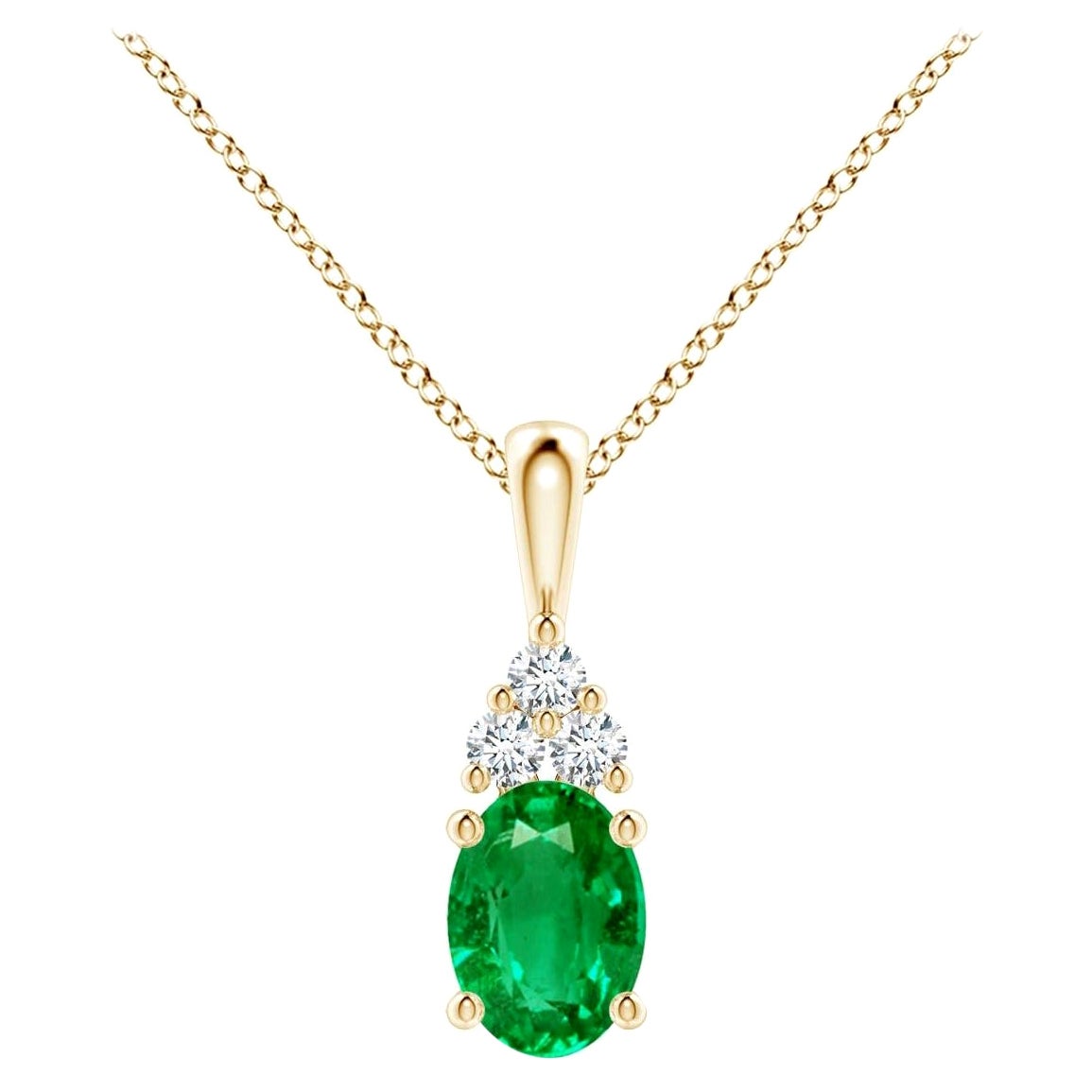 Pendentif solitaire en or jaune avec émeraude naturelle et diamants, taille 7 x 5 mm en vente