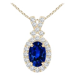 ANGARA Natural 0.60ct Blue Sapphire Pendant with Diamond Halo in 14K Yellow Gold