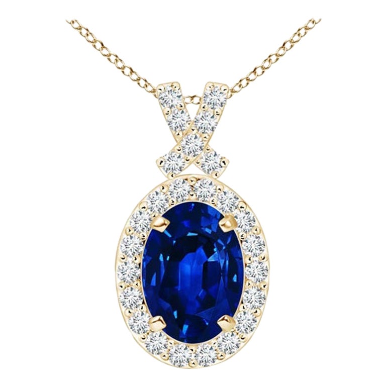 ANGARA Natural 0.85ct Blue Sapphire Pendant with Diamond Halo in 14K Yellow Gold For Sale