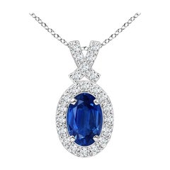 ANGARA Natural 0.60ct Blue Sapphire Pendant with Diamond Halo in 14K White Gold