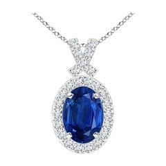 ANGARA Pendentif en or blanc 14 carats avec saphir bleu naturel de 0,85 carat et halo de diamants