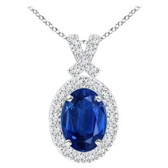 ANGARA Natural 0.85ct Blue Sapphire Pendant with Diamond Halo in 14K White Gold