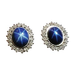 Vintage 1960s, Sapphire Star Cabochon and Diamonds Halo 18k white Gold Cluster Earrings