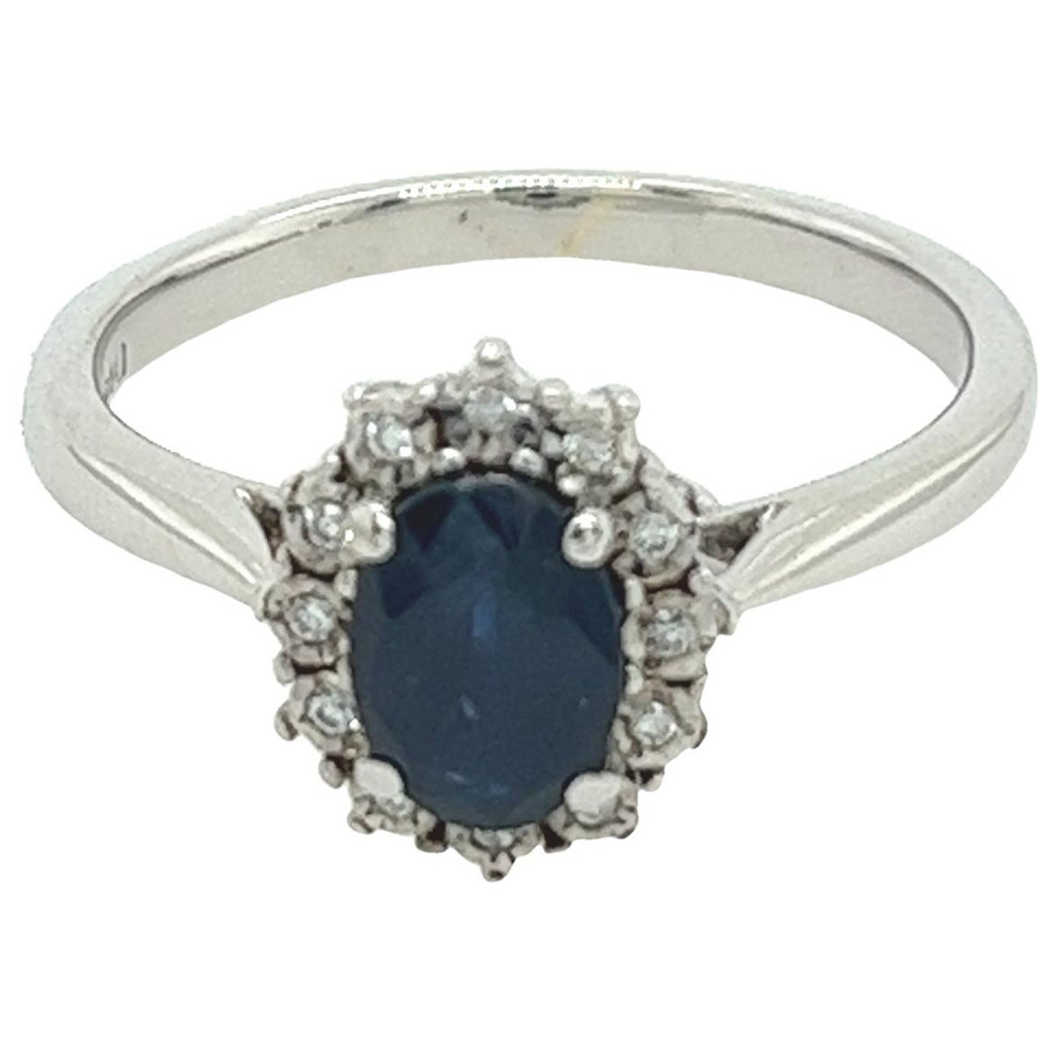 Classic Oval Sapphire Ring Surrounded by 12 Diamonds in 9ct White Gold For Sale