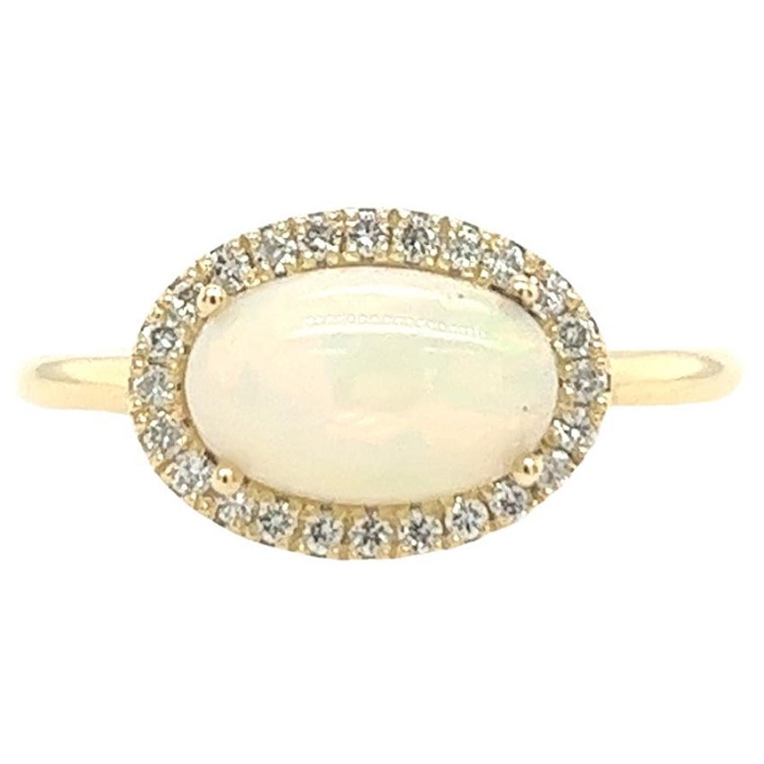 Cabochon Oval Opal Ring Surrounded by 24 Diamonds in 14ct Yellow Gold For Sale