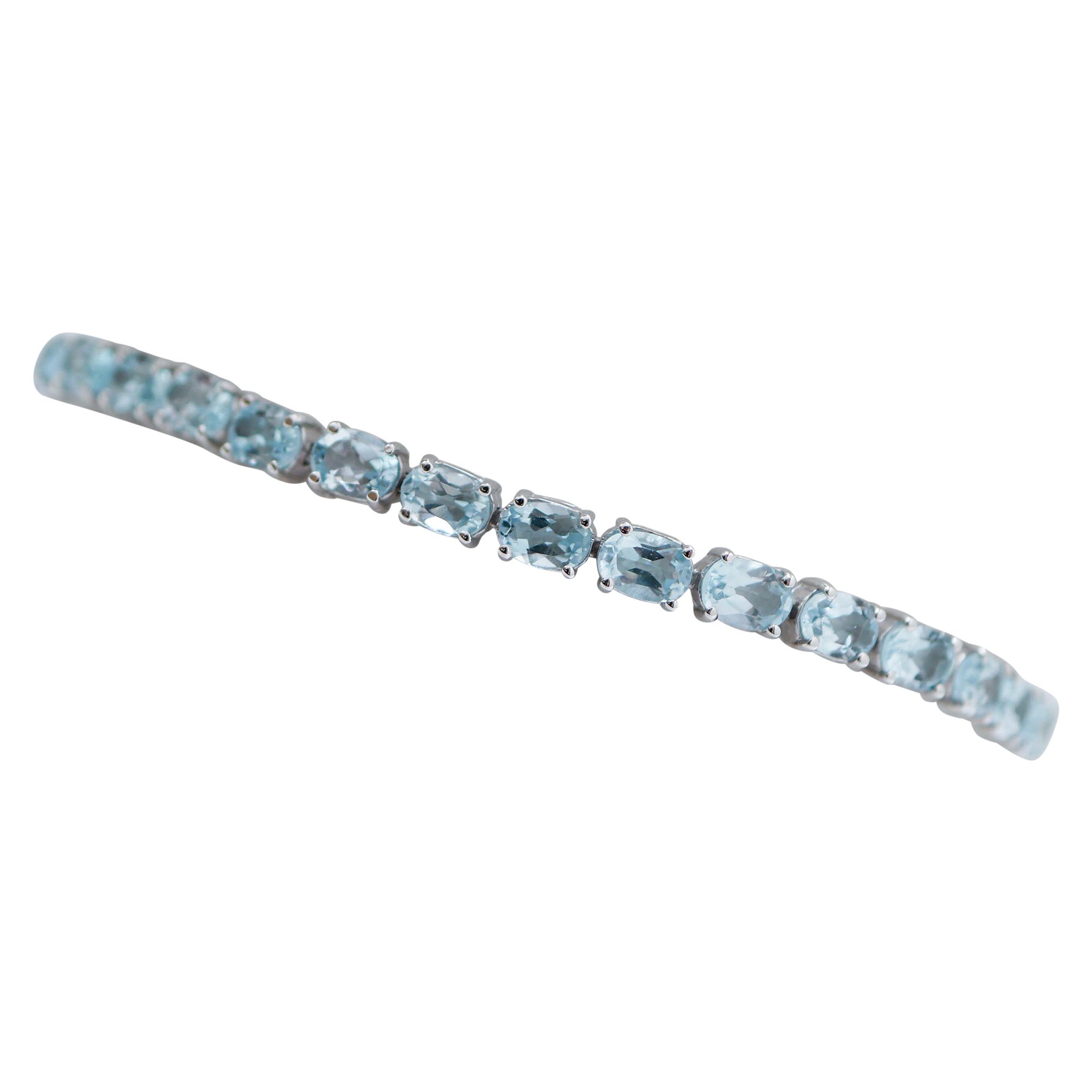 Bracelet tennis en or blanc 14 carats, topaze et aigue-marine de couleur.