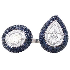 Fancy Diamonds Cuff Ring with Blue Sapphire set in 18k Solid Gold