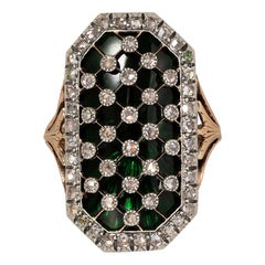 gold and silver bague au firmament with green glass and diamonds