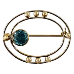 Vintage 10K Yellow Gold Open Oval Blue Zircon Brooch #15684